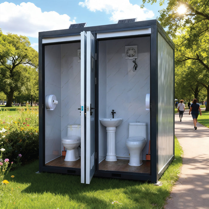 TMG-FTD07 7ft portable restroom with two private stalls, ceramic toilets, triangular sinks, and solar exhaust fan in durable steel frame
