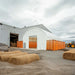 40' x 40' Dual Truss Container Shelter with Heavy Duty 21 oz PVC Cover, Fully Enclosed front and back endwalls, TMG-DT4041CG - TMG Industrial