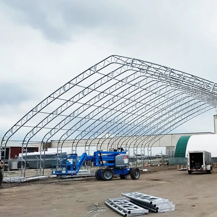 TMG Industrial Pro Series 70' x 150' Dual Truss Storage Shelter with Heavy Duty 32 oz PVC Cover & Drive Through Doors, TMG-DT70150-PRO