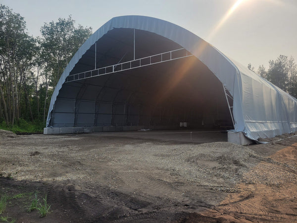 60’ x 120’ Dual Truss Shelter, Extra Height, on concrete blocks. 2023, Charlston, SC, U.S.A.