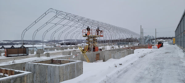 60’ x 150’ Dual Truss Shelter built on concrete knee wall. 2022, Montreal, QC Canada.